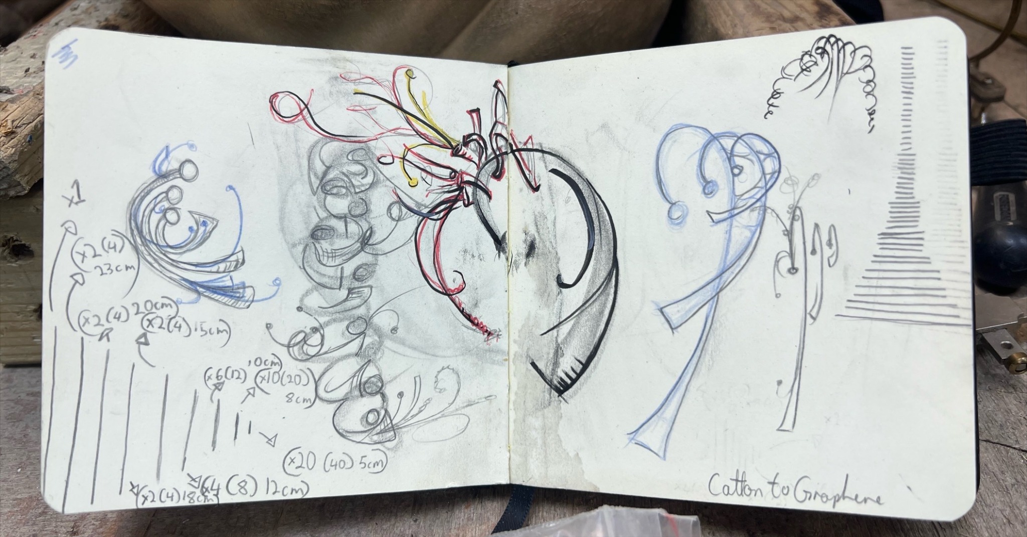 Isla Paine’s open sketchbook with curved necklace studies, measurements and construction notes.